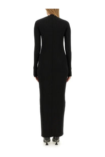 The attico women’s black ribbed knit long-sleeved maxi dress shown from the back side