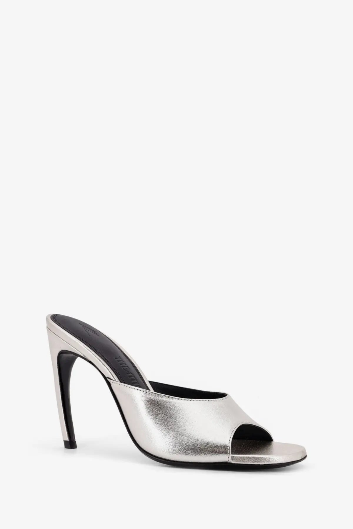 The attico women’s laminated leather betta sandals silver feature a silver metallic mule heel with a black insole