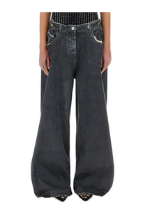 Dark-wash denim wide-leg pants with subtle stitching and slight distressing in navy blue grey by the attico