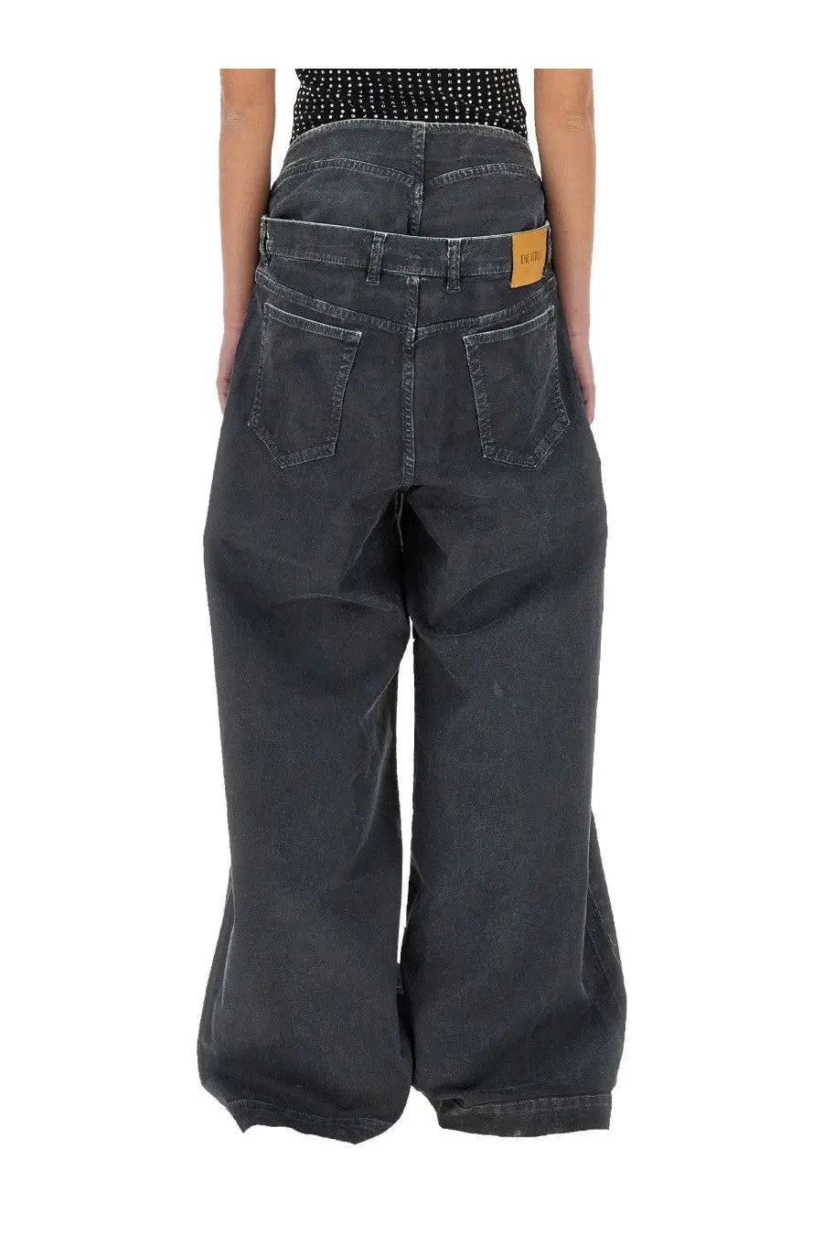The attico women’s long navy blue grey denim wide-leg pants shown from the back with classic pockets and relaxed fit