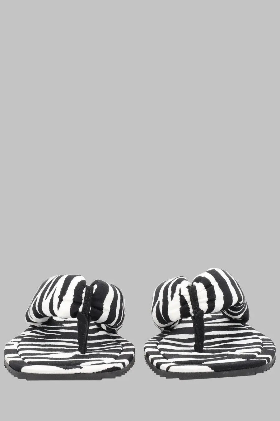 The Attico women’s Sandalo Indie pattern flip-flops feature black and white striped plush textured design