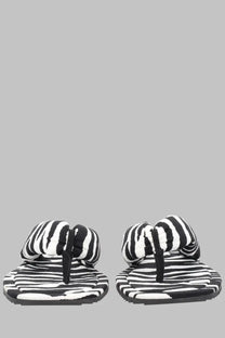 The Attico women’s Sandalo Indie pattern flip-flops feature black and white striped plush textured design
