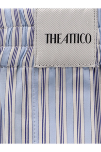 The attico women’s striped cotton shorts white feature a light blue and white striped shirt with fine navy vertical stripes