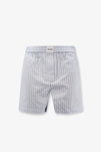 The Attico women’s striped cotton shorts in white feature light gray and white vertical stripes with a branded waistband label