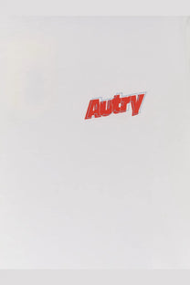 Red autry logo in stylized bold font with white outline on autry men’s white cotton shirt front