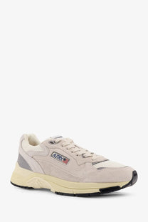 Autry men’s hyperway low top sneakers in beige suede and mesh with gray accents cream midsole and black outsole