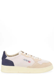 Autry men’s Medalist low sneaker in beige and navy suede with white laces and cream rubber sole featuring logo patch