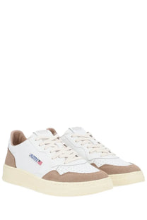 Autry men’s medalist low sneaker in white and beige suede and leather with cream rubber sole and blue logo on side
