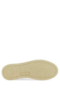 Beige rubber sole with circular tread pattern and embossed brand logo on autry men’s medalist low sneaker white