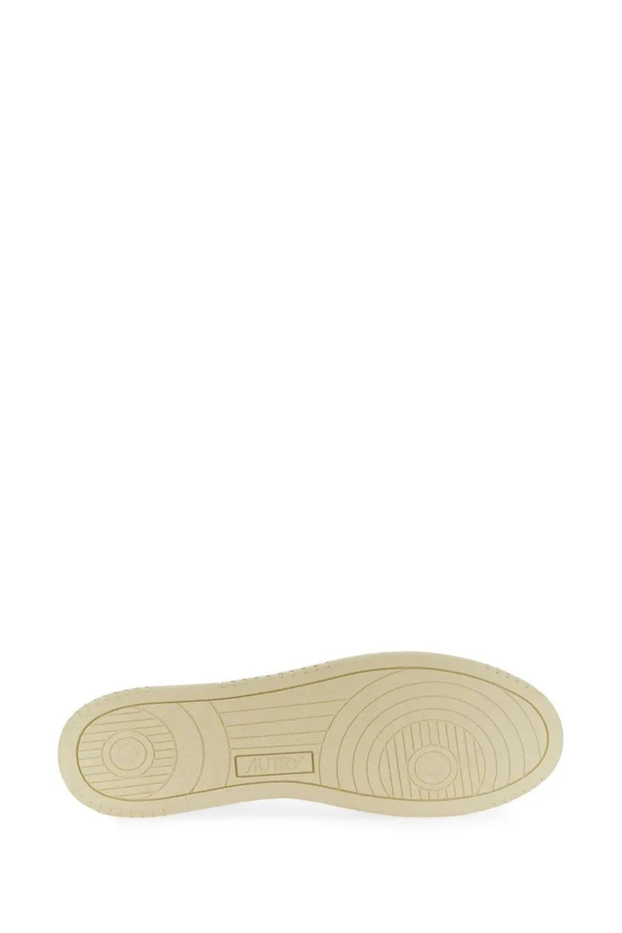 Beige rubber sole with circular tread patterns and subtle brand logo imprint on autry men’s medalist low sneaker white