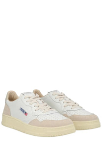 Autry men’s medalist low sneaker in white with beige suede and leather, perforated toe box, and embroidered vatry logo