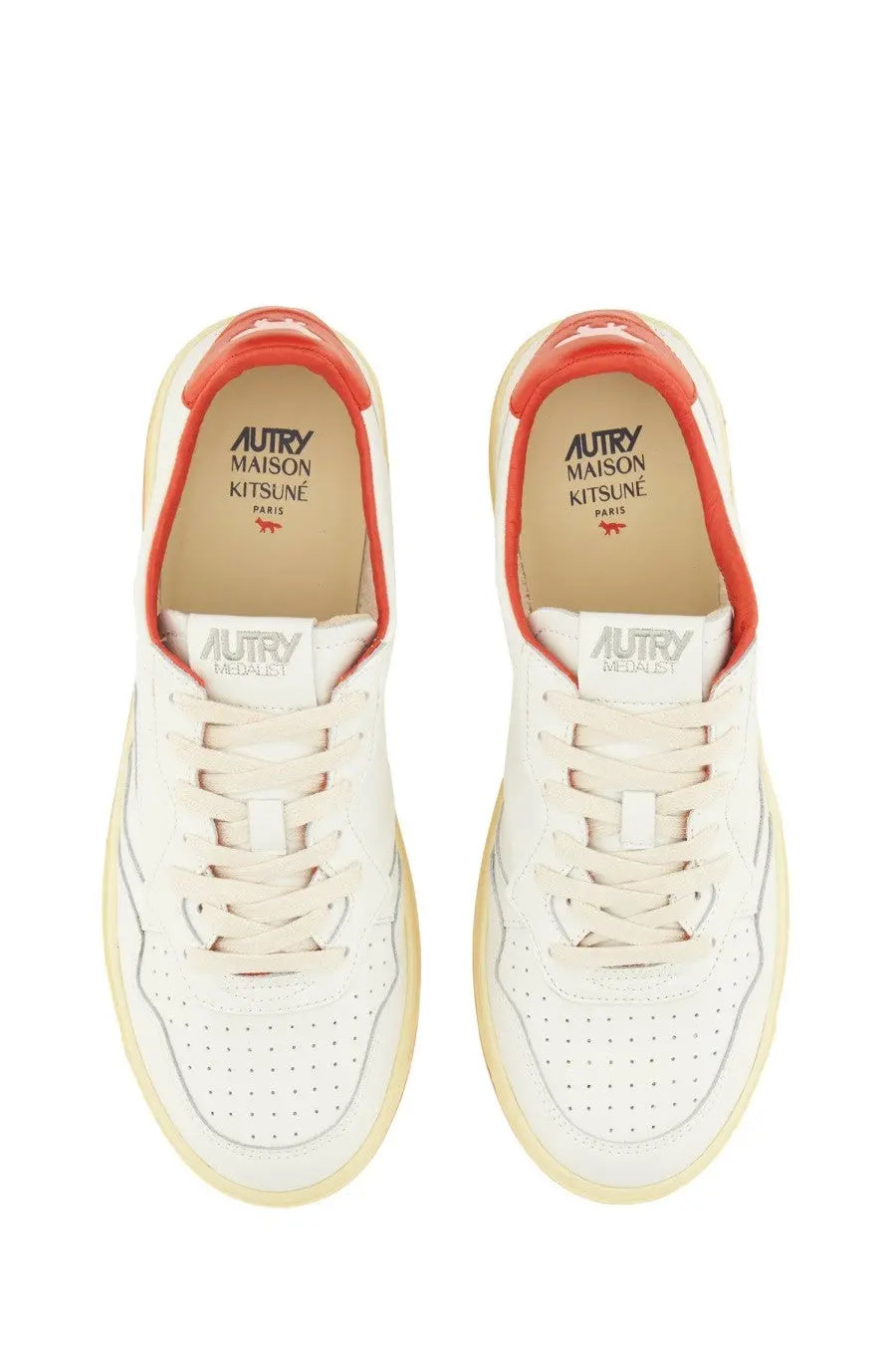 Autry men’s medalist low sneaker in white leather with orange accents and perforated detailing
