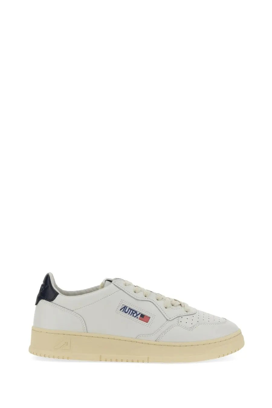 Autry men’s Medalist low sneaker in white leather with black heel tab beige rubber sole and subtle autrx logo patch