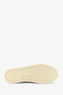 Cream-colored rubber sole with circular tread and rectangular brand logo imprint on autry men’s medalist low white sneaker