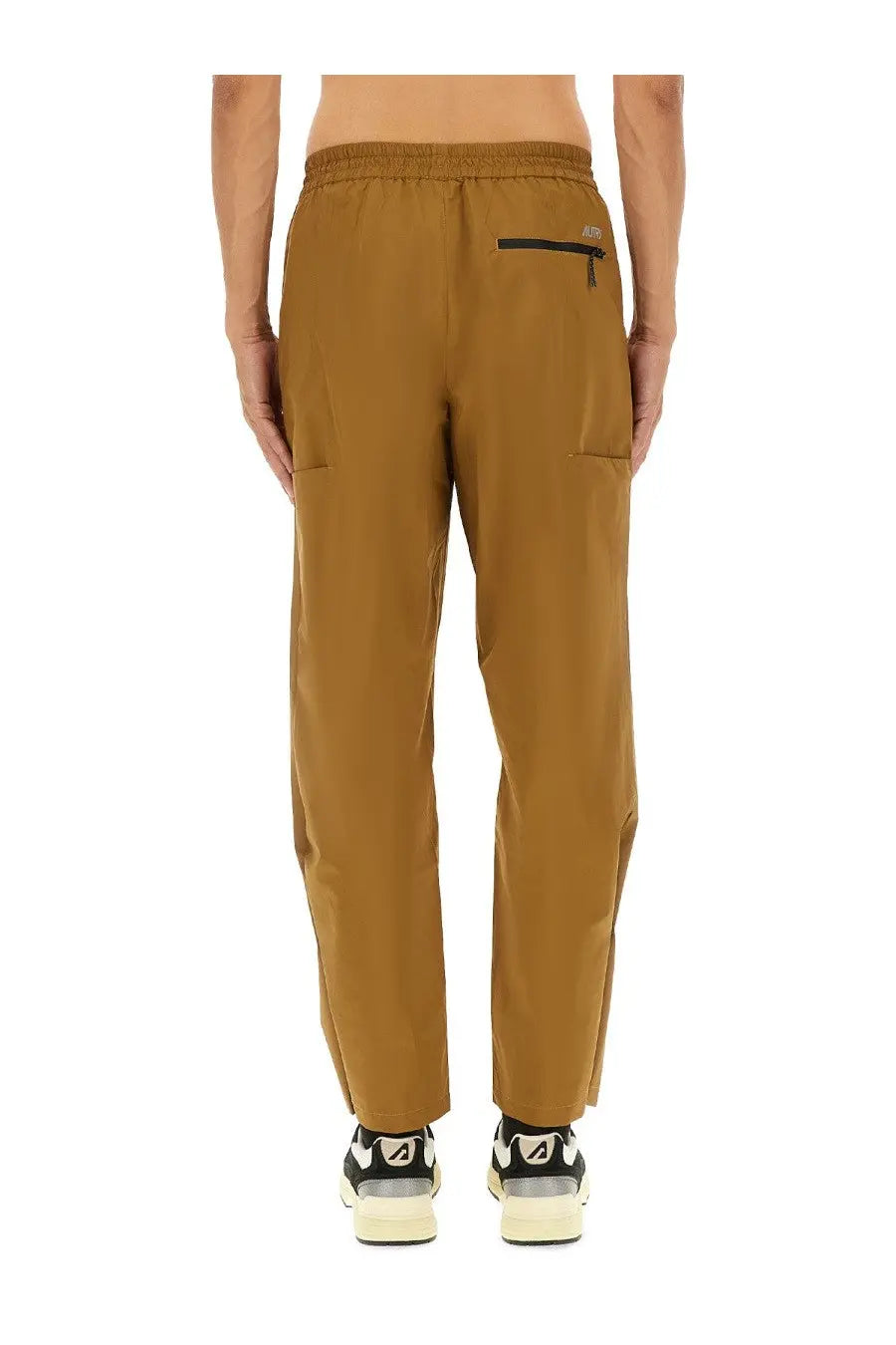 Back view of autry men’s rain tech nylon pants brown with tan elastic waist and subtle black zipper pocket