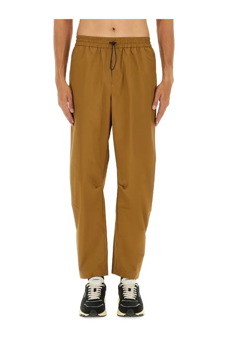Autry men’s rain tech nylon pants in brown with tan relaxed fit, elastic waistband, and black drawstring