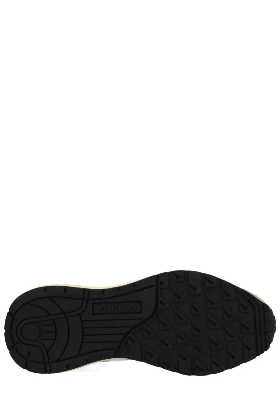 Black rubber sole with textured tread and adidas logo embossed near heel of autry mens reelwind low sneakers beige back side
