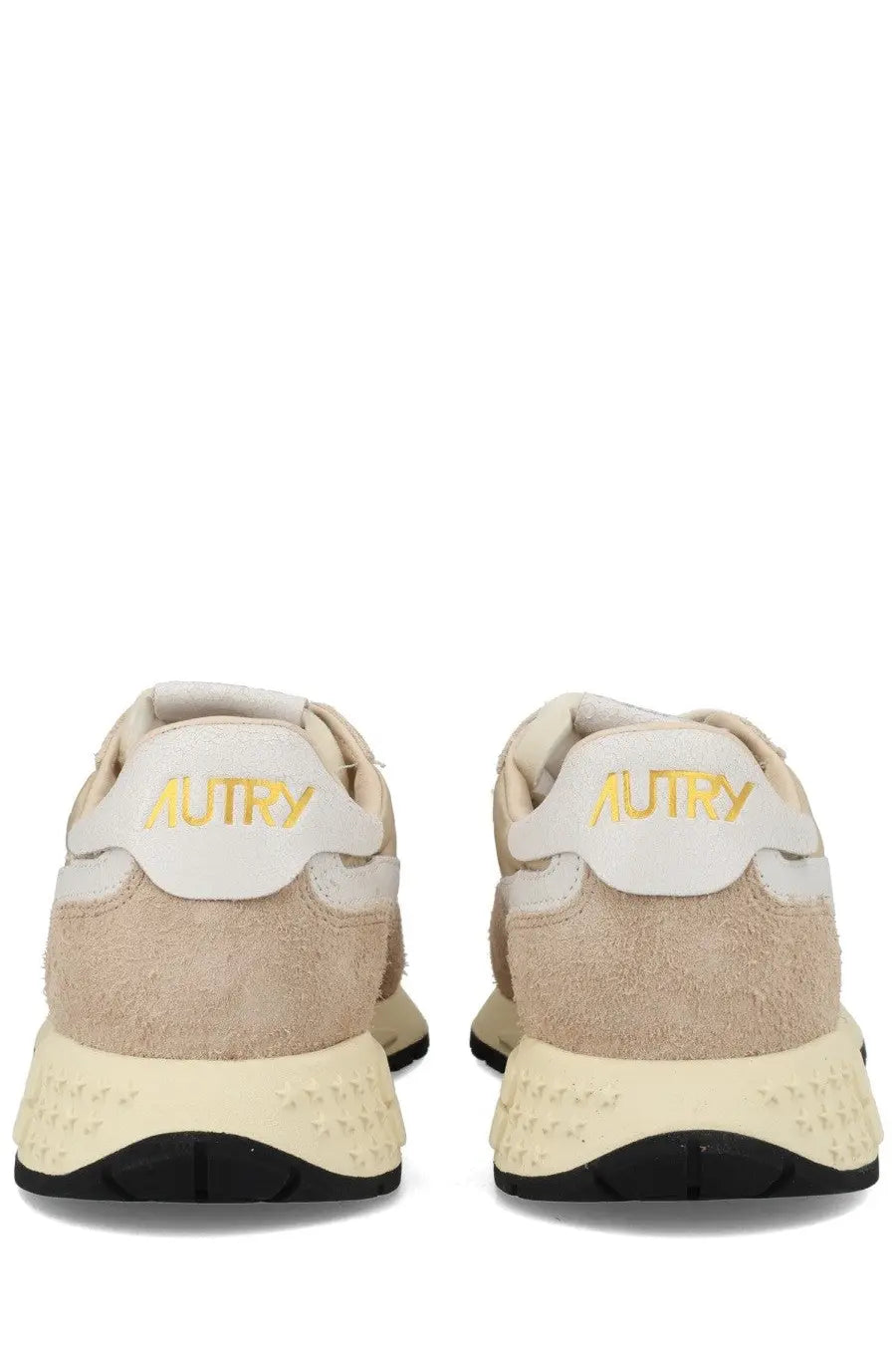 Beige suede and white leather autry men’s reelwind low sneakers back view with gold autry branding on the heel
