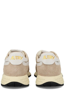 Beige suede and white leather autry men’s reelwind low sneakers back view with gold autry branding on the heel