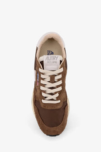 Autry men’s Reelwind low suede sneaker in brown suede and leather with cream laces and autry reelwind branding on tongue