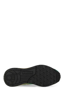 Black rubber sole with textured tread and adidas logo on the heel of autry men’s reelwind supervintage green sneaker back view