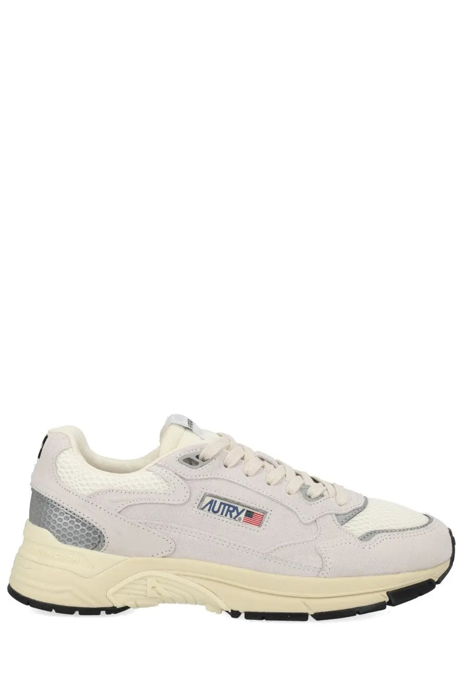 Cream-colored autry men’s sneaker with suede and mesh and gray accents on heel and side panels