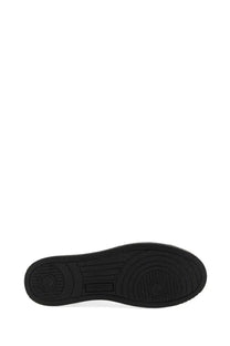Black rubber sole with circular tread patterns and smooth raised edge on autry men’s sneaker medalist low multicolor