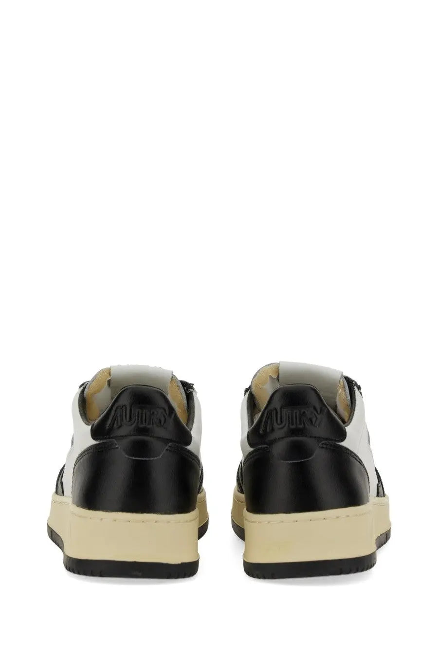 Black and white low-top autry men’s sneaker medalist low with glossy finish and embossed brand name on the heel back side