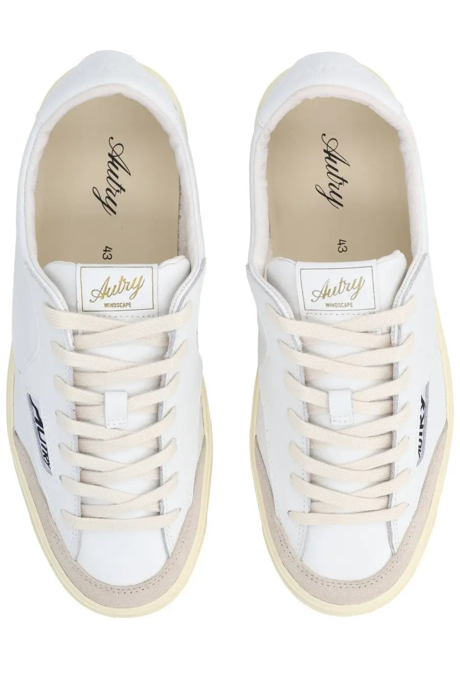 Autry men’s sneaker windscape low white white leather with beige rubber soles and minimalist branding on side and heel
