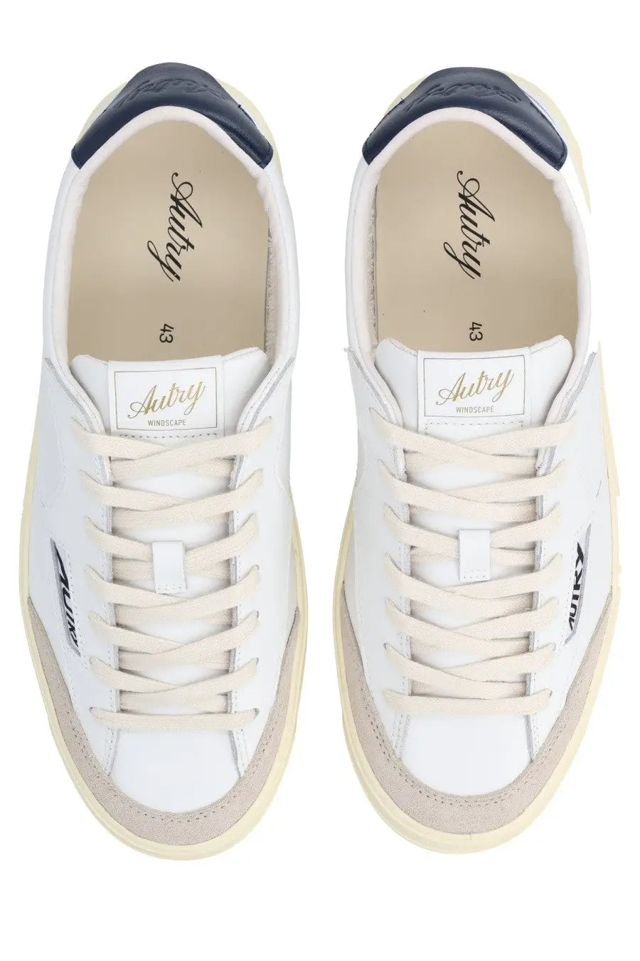 Autry men’s sneaker windscape low white leather with navy heel tabs beige rubber soles and aubry branding on side and insole