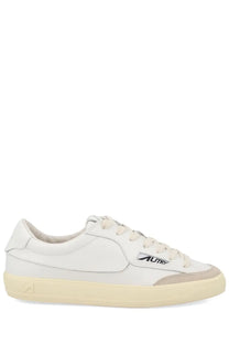 Autry men’s sneaker windscape low white leather low-top with beige rubber sole and subtle gray accent panel