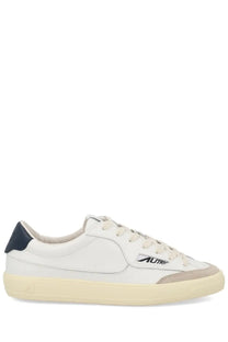 Autry men’s sneaker windscape low white leather low-top with navy blue heel tab beige rubber sole and subtle logo on side