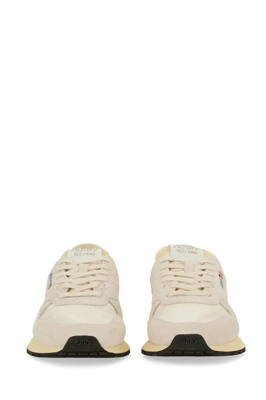 Back view of autry men’s sneakers reelwind low cream suede and canvas with black rubber sole and aury embossed heel