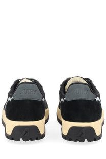 Autry men’s wildpace low sneaker black suede with beige rubber sole and gray heel tab featuring autry logo