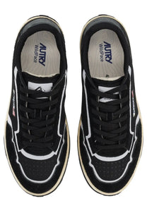 Autry men’s wildpace low sneaker in black and white suede and mesh with bold white stitching and cream rubber sole