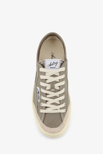 A muted olive canvas sneaker with cream laces and sole by Autry from the Men’s Windscape collection