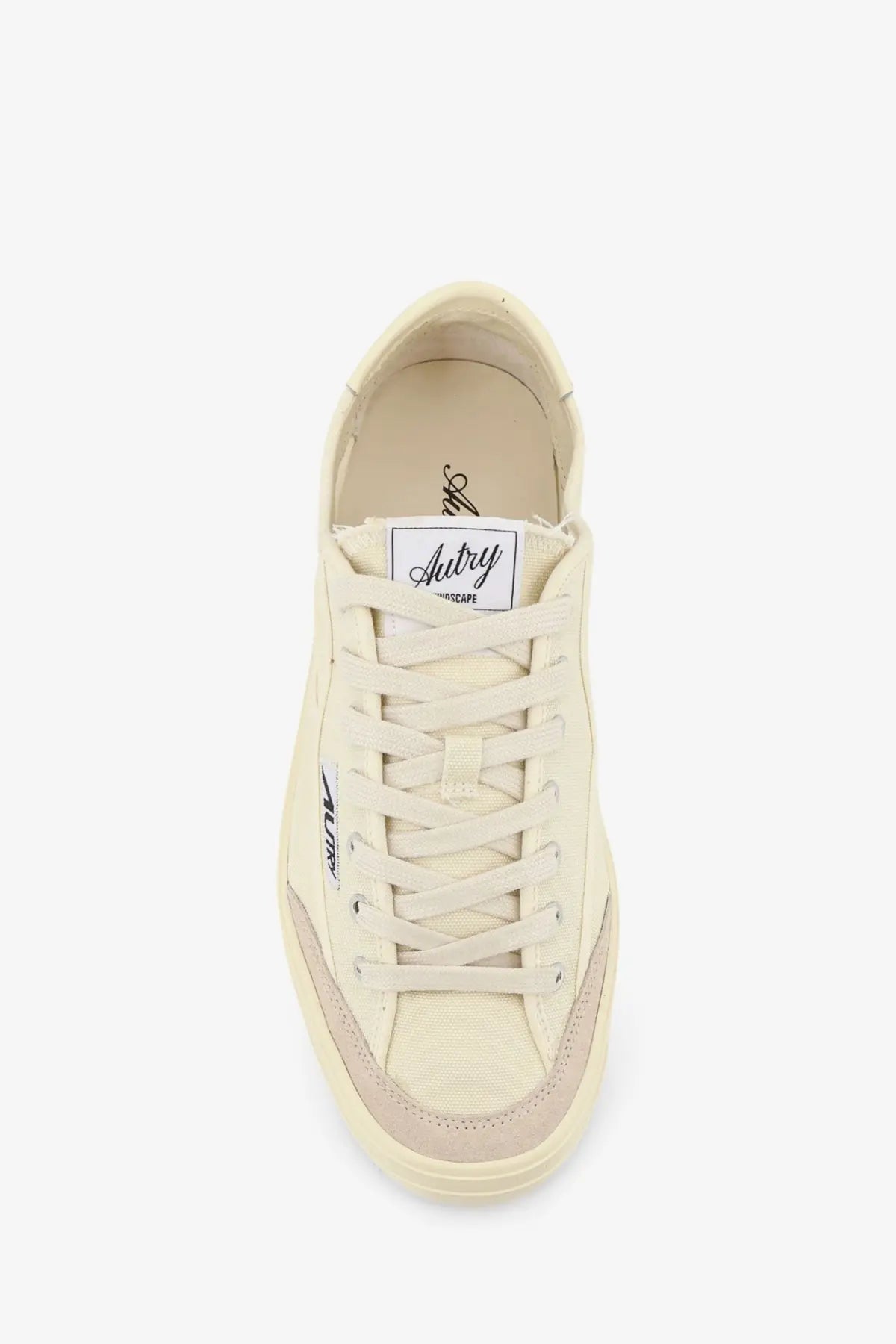 Autry men’s windscape canvas sneakers in cream color with beige rubber sole and subtle branding on the tongue