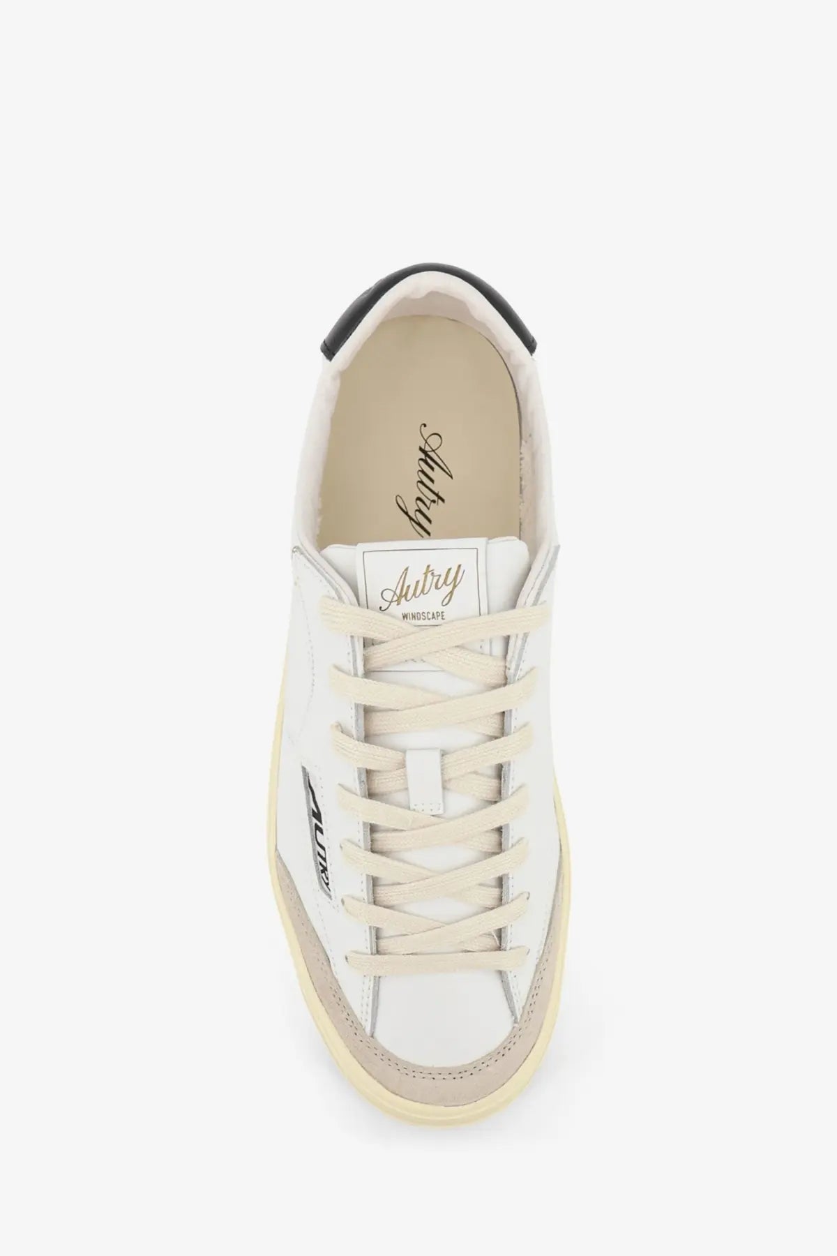 Autry men’s windscape leather sneaker in white with beige laces and black rubber toe cap low-top design