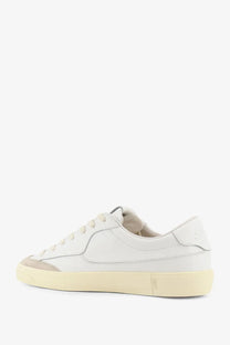 Autry men’s Windscape leather sneakers in white feature low-top design with beige rubber sole and gray toe cap accents