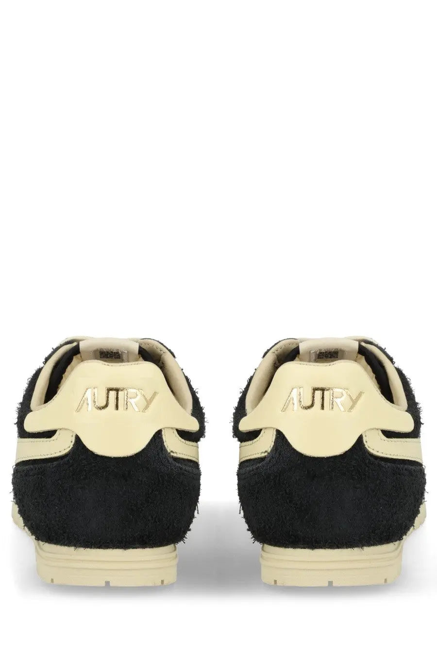 Back view of autry men’s windspin sneaker black in black and cream suede with retro textured design and autry logo on heel