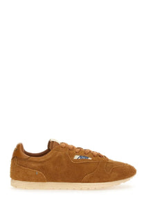 Autry men’s windspin sneaker in tan suede with cream rubber sole and subtle side branding low-top design