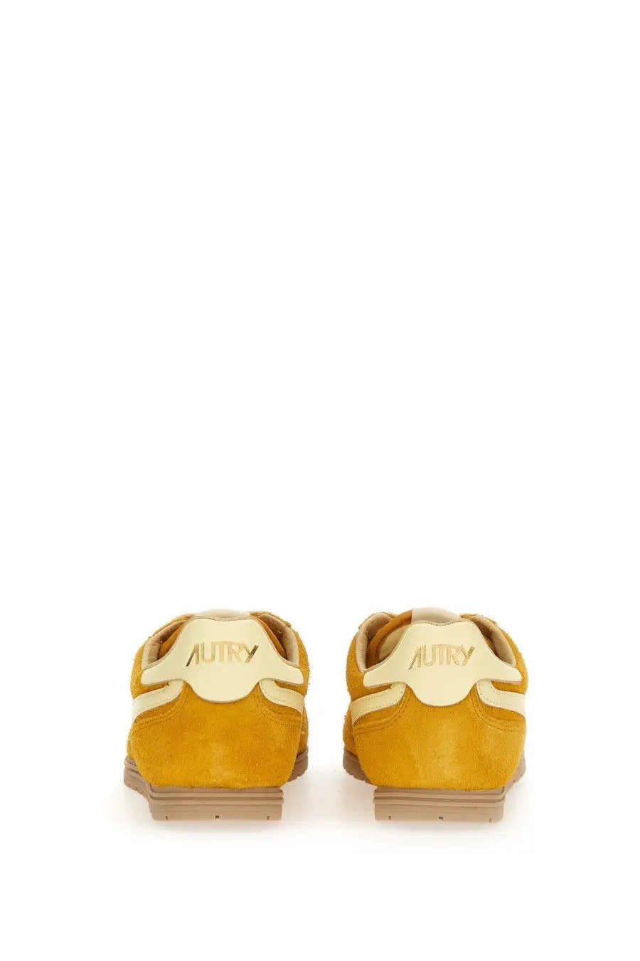 Autry men’s windspin sneaker back view in yellow suede with cream accents and autry embossed heel rubber sole