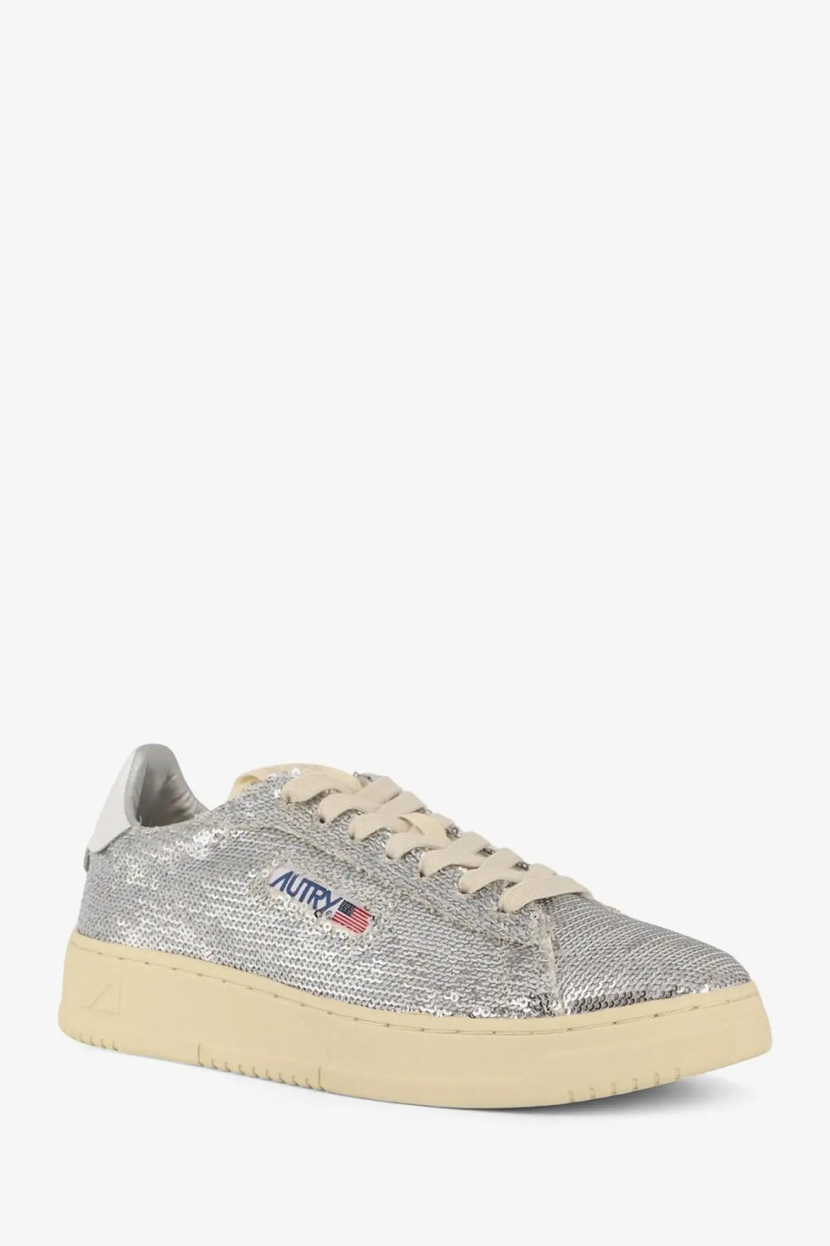 Autry women’s dallas low-top sneaker in silver sequins with cream laces sole and blue embroidered logo with american flag