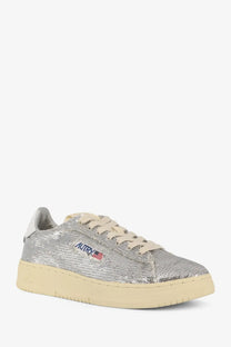 Autry women’s dallas low-top sneaker in silver sequins with cream laces sole and blue embroidered logo with american flag