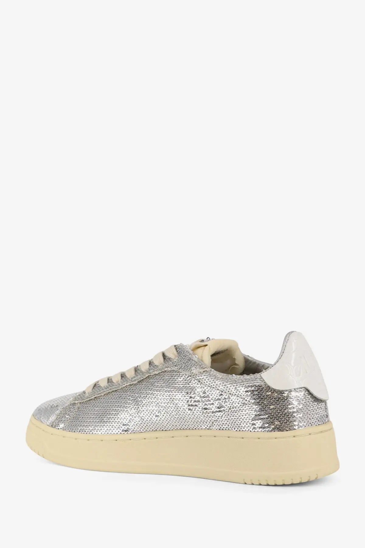Autry women’s dallas sneaker silver sequined low-top with cream rubber sole and white leather heel tab side view
