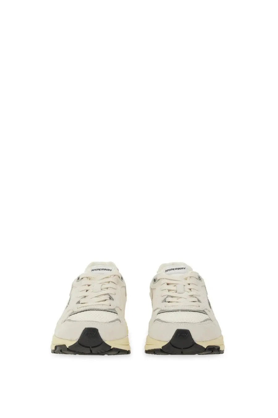 Autry women’s Hyperway sneaker in cream with sleek minimalist design and black rubber soles for casual wear