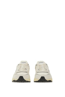 Autry women’s Hyperway sneaker in cream with sleek minimalist design and black rubber soles for casual wear