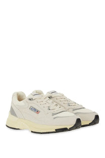 Cream-colored autry women’s hyperway sneaker with gray and black accents featuring a classic athletic design