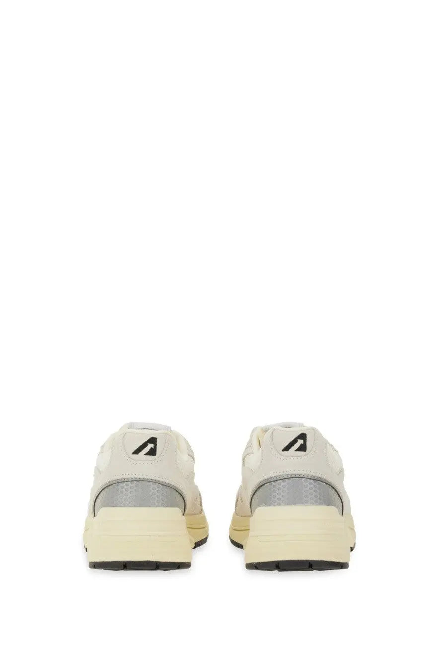 Autry women’s hyperway sneaker white cream-colored with gray mesh panels and black rubber soles minimalist design