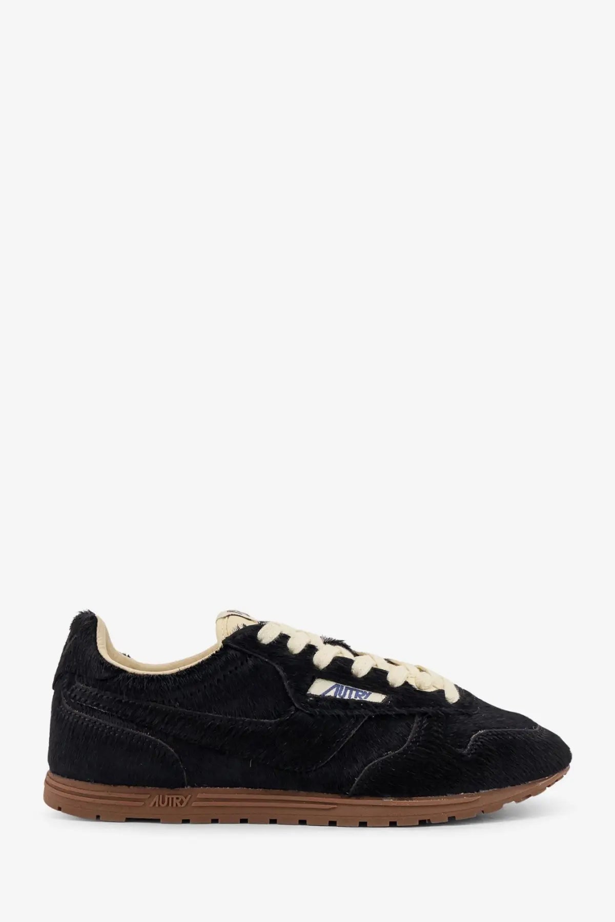 Autry women’s low top windspin pony skin sneakers in black suede with cream laces and tan rubber sole featuring the logo